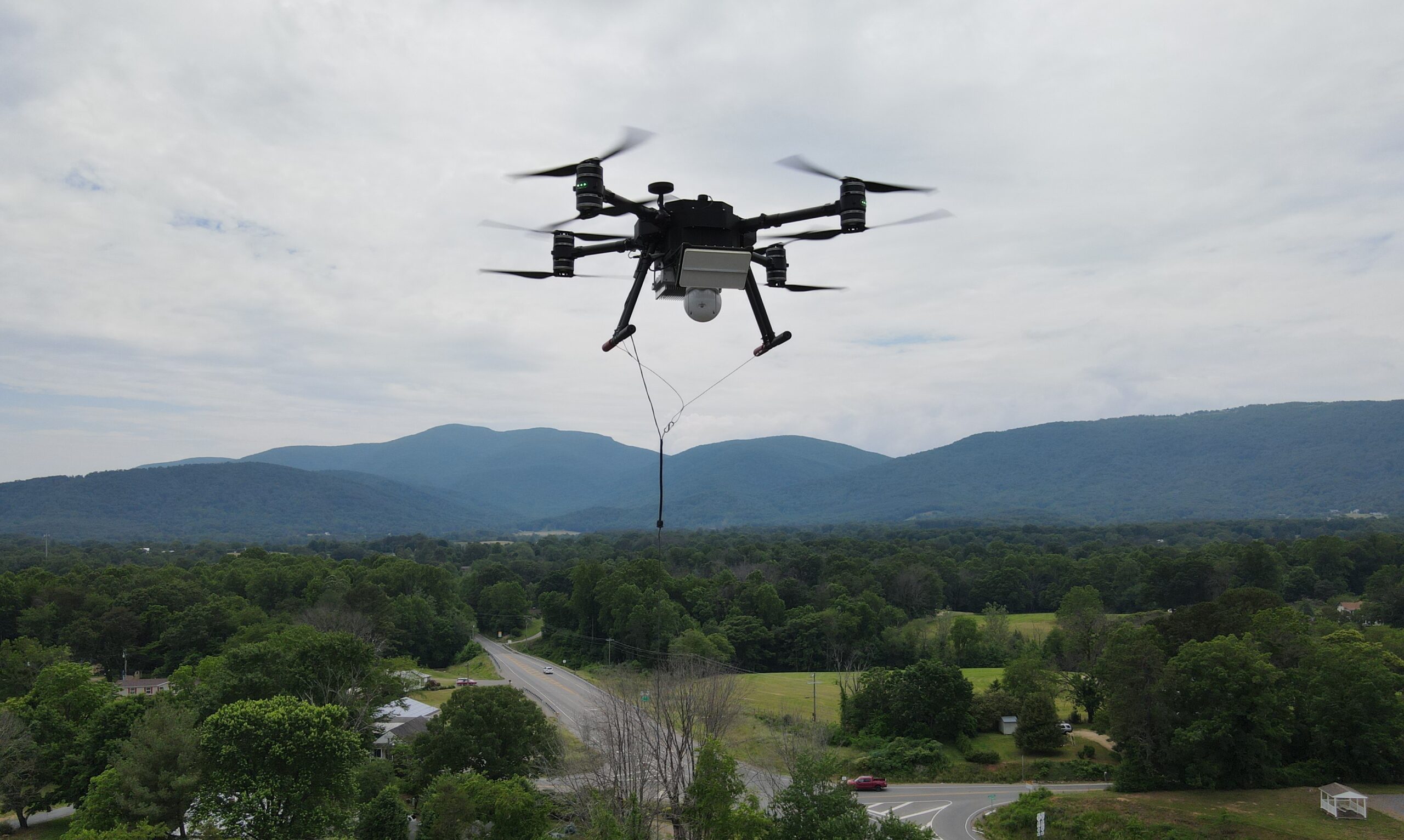 Quad-8 tethered drone with integrated radar payload